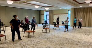 residents and staff take a jazzercise class